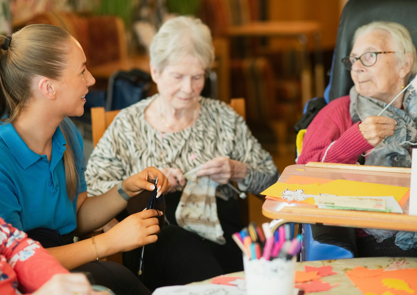 A family caregiver checking in on her mother in a sunlit room